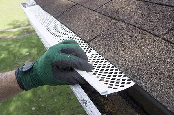 gutter guards can help to minimize the risk of ice dams by keeping gutters clear and allowing water to flow freely